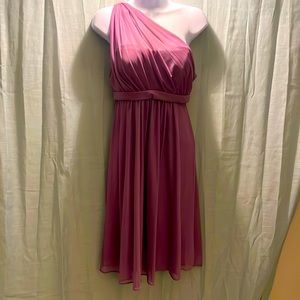 Bridesmaid dress. Size 6. New with tags. The color wisteria.